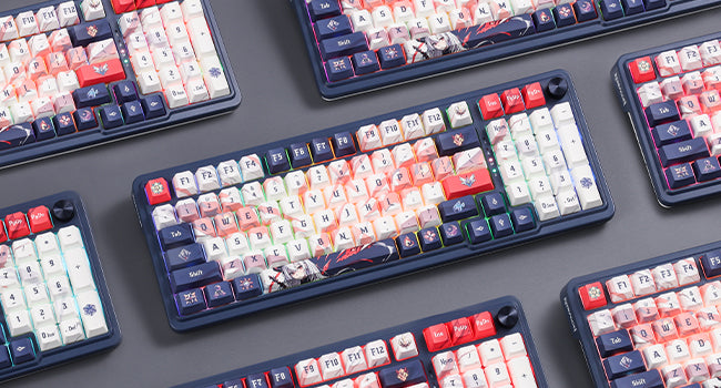 Multiple mechanical keyboards with colorful keycaps on a gray surface